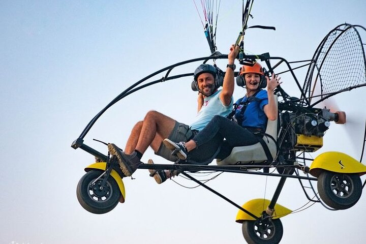 Experience Dubai from above soaring over stunning dunes and picturesque lakes. Capture the beauty of the desert landscape during a unique paramotor adventure that promises unforgettable views.